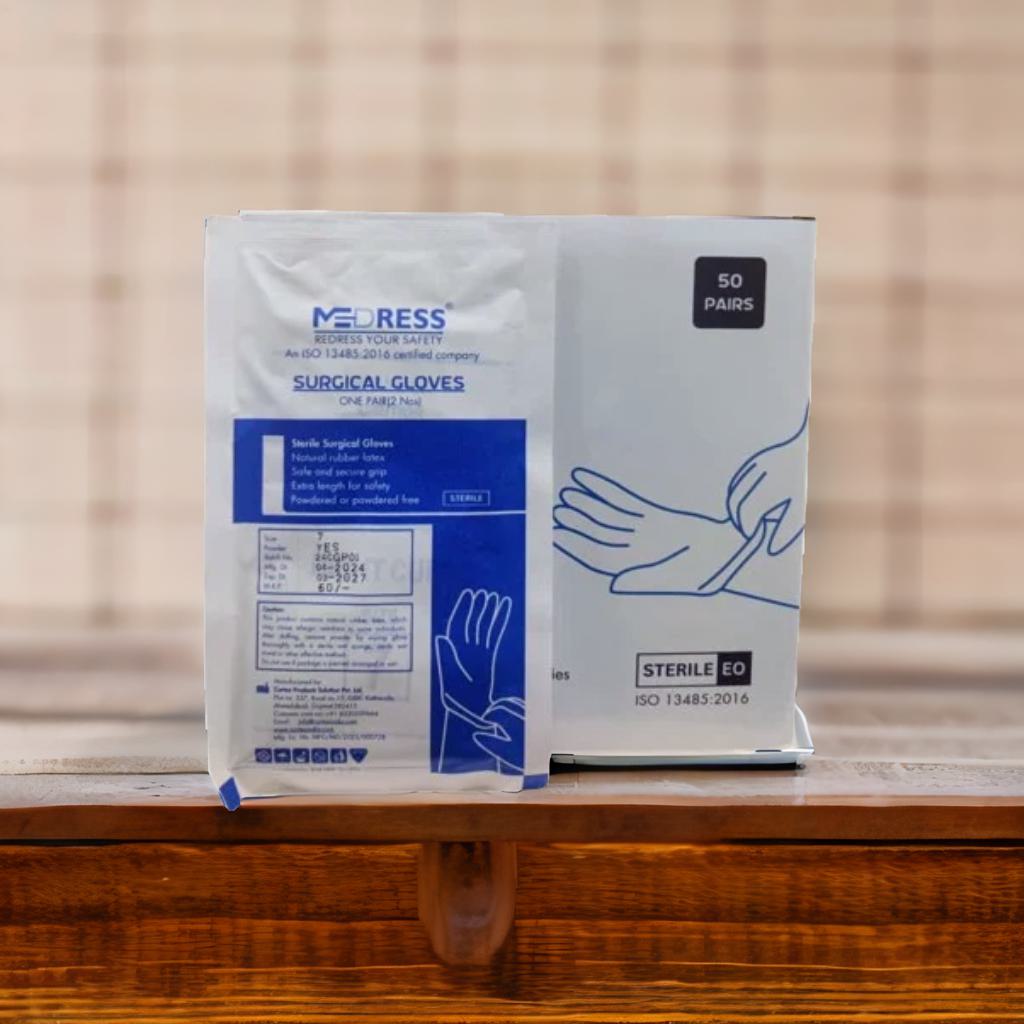 A pack of MEDRESS disposable surgical gloves in white color, with 50 pairs indicated on the front. The packaging is sterile and it is designed with blue text and graphics on a white background.