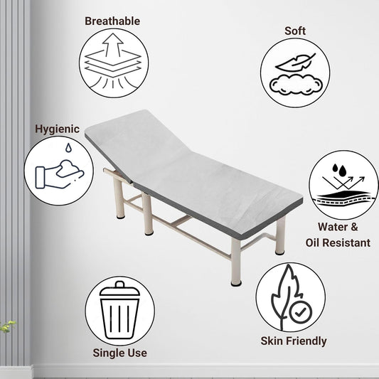 disposable bedsheets on Medical examination table with icons indicating features like breathable, soft, hygienic, water & oil resistant, single use, and skin friendly.