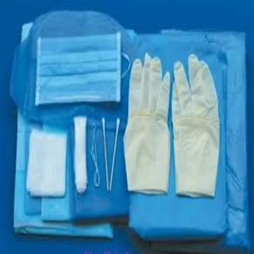 A medical delivery kit including disposable gloves, a mask, and other medical supplies laid out on a blue surface.