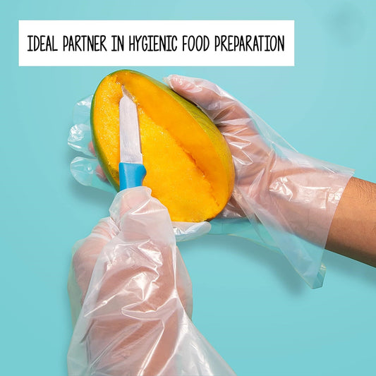 Person cutting a mango with using of compostable Ecoz hand gloves 