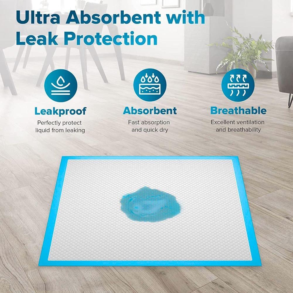 Absorbent pad with blue liquid spill on a wooden floor, and featuring like a  absorbency and leak protection.