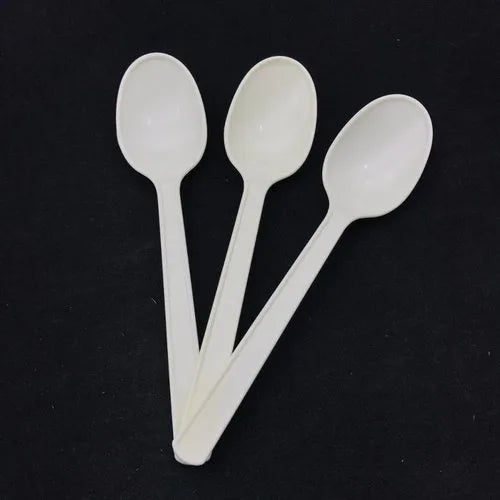 A set of Ecoz white disposable biodegradable dessert spoons. 