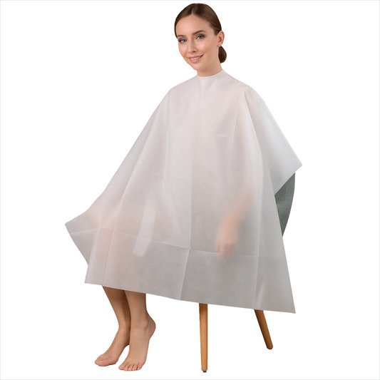 Woman wearing a white hairdressing cape or salon apron white 